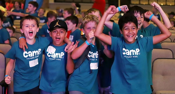 Young boys at Kids Camp having fun in the auditorium