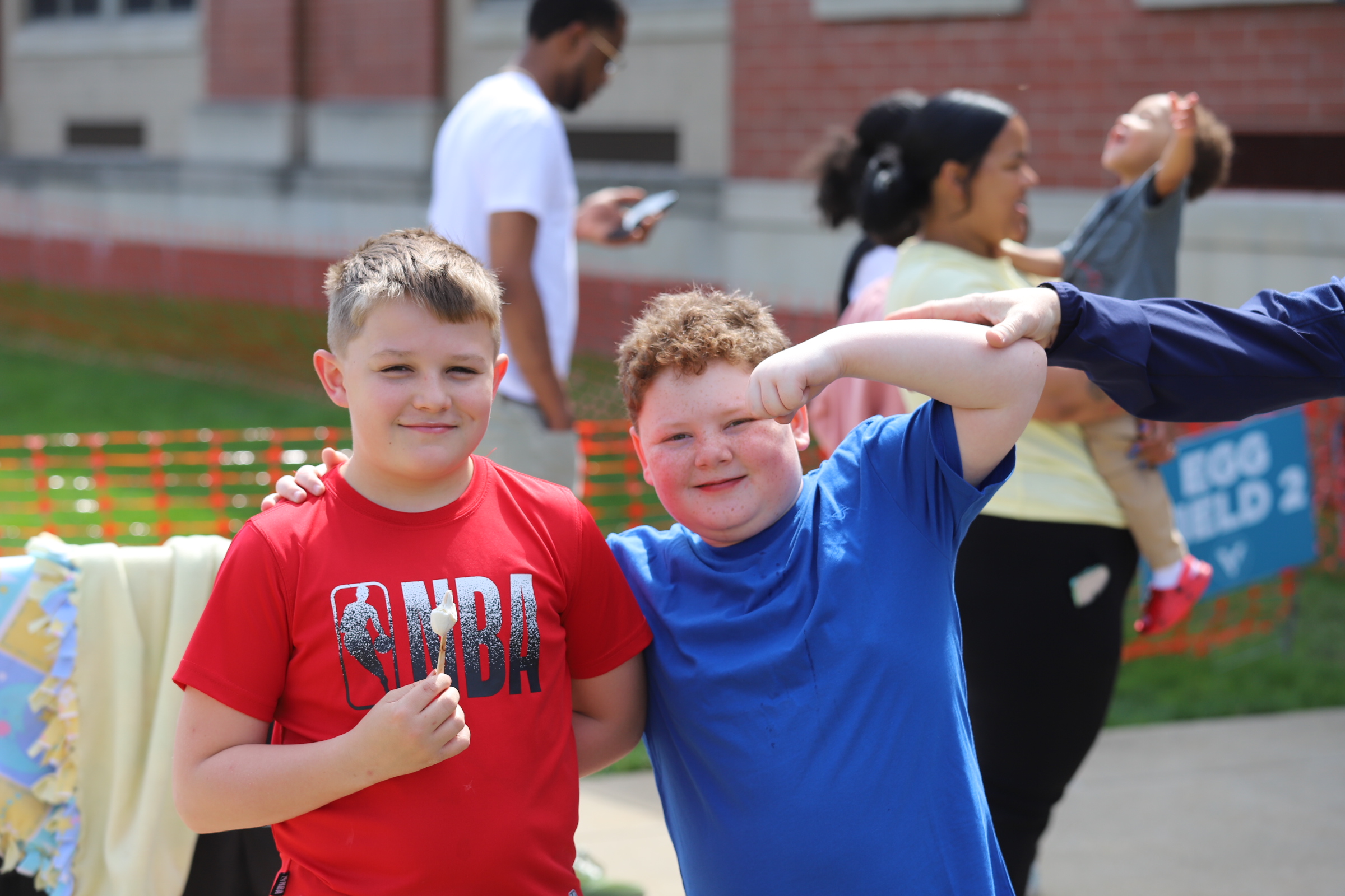 IMG_4443 Two kids posing with person dressed up as Captain America at Eggstravaganza